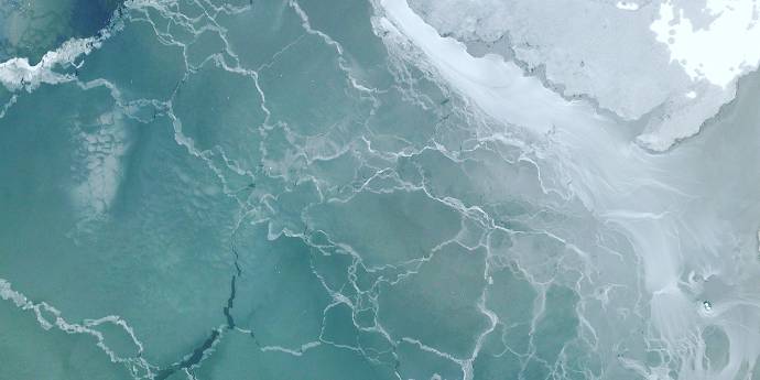 aqua coloured sheet of ice