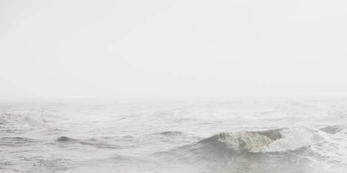 grey coloured waves breaking