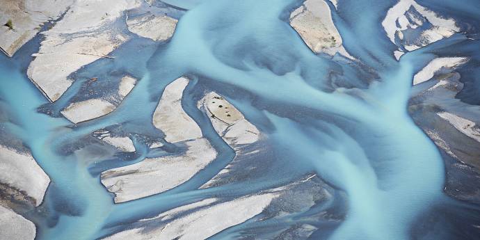 aerial view of a braided blue river